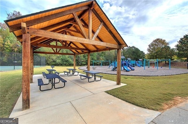 view of community with a lawn and a playground