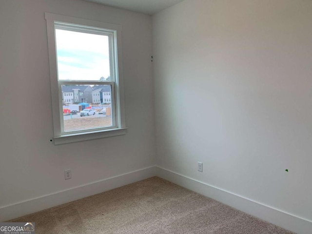 spare room featuring carpet floors