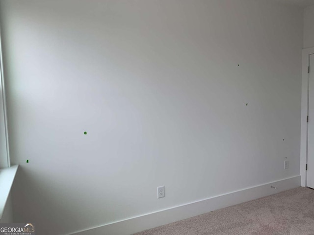 empty room featuring carpet flooring