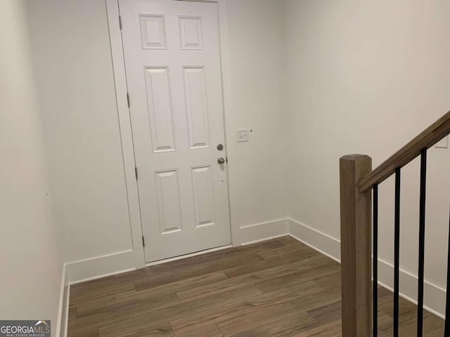 foyer with dark hardwood / wood-style floors