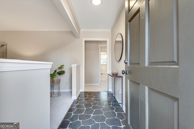 entryway featuring crown molding and beamed ceiling