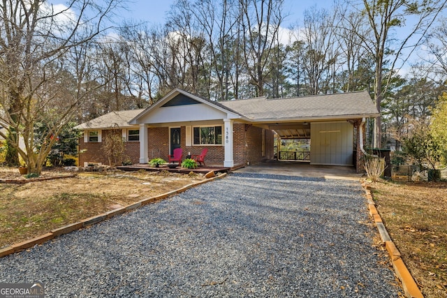 ranch-style home with a carport and covered porch