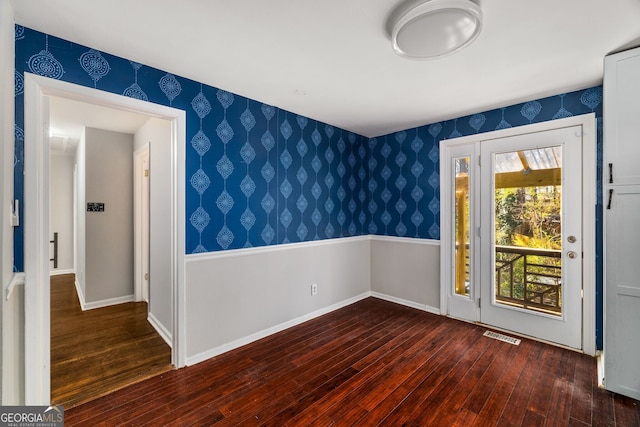 empty room with dark hardwood / wood-style floors