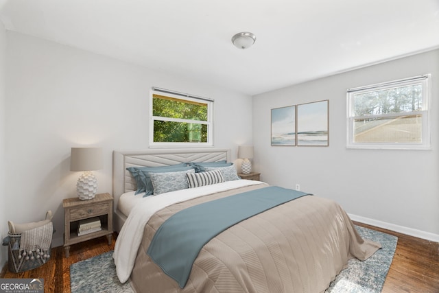 bedroom featuring dark wood-type flooring