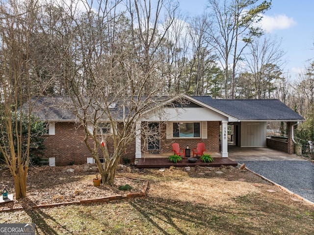 view of front of property with a carport and covered porch