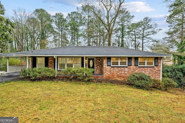 single story home with a carport and a front yard