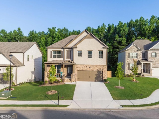 view of front of house with cooling unit, a garage, covered porch, and a front lawn