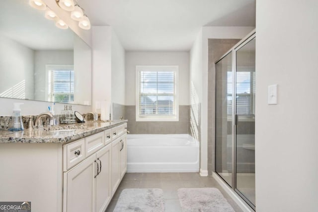 bathroom with shower with separate bathtub, tile patterned floors, and vanity