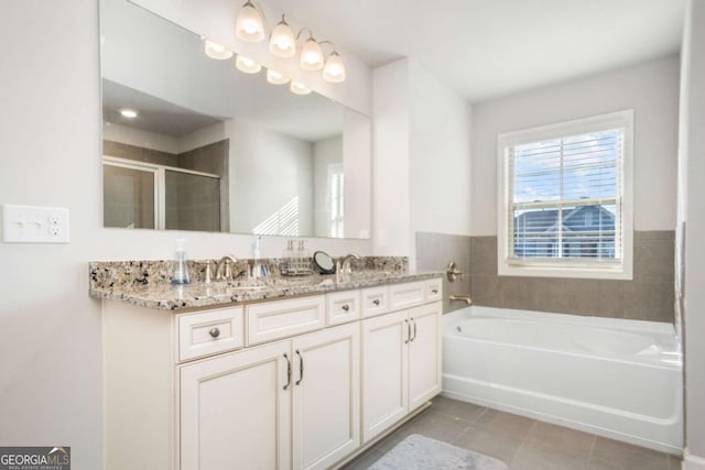 bathroom featuring vanity, tile patterned floors, and plus walk in shower