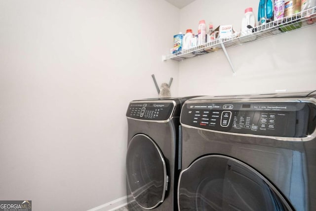 laundry area with separate washer and dryer