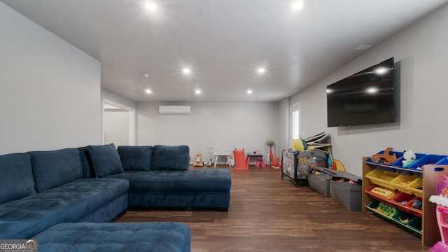 living room with dark wood-type flooring and a wall unit AC