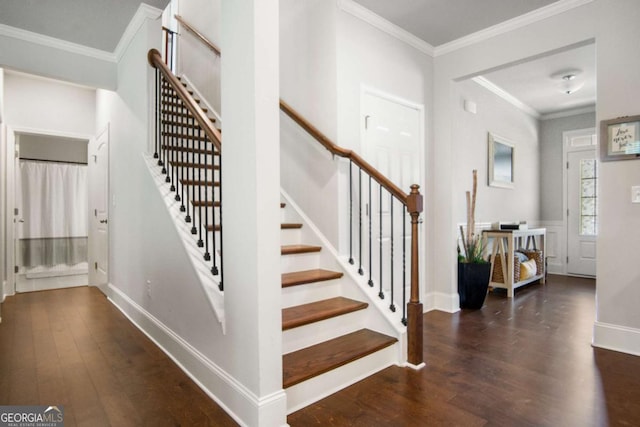 stairway with ornamental molding and hardwood / wood-style floors