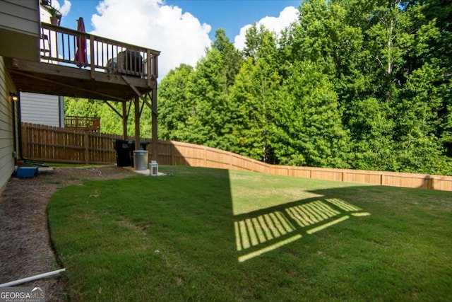 view of yard with a wooden deck