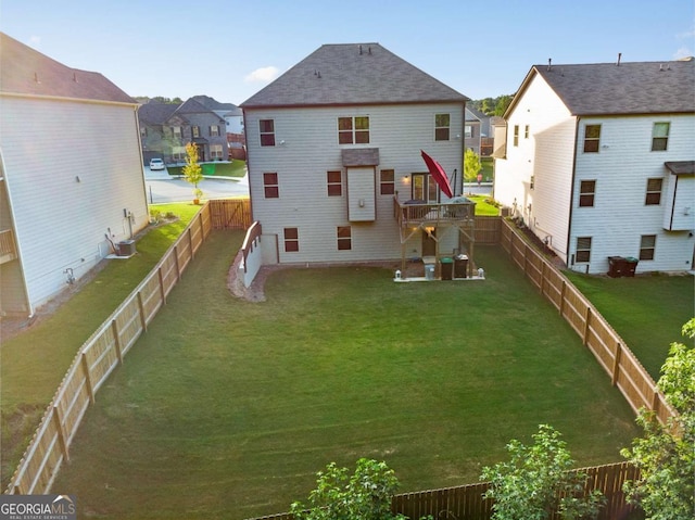 back of house with a lawn