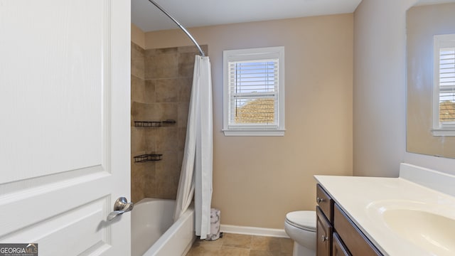 full bathroom featuring tile patterned floors, vanity, toilet, and shower / tub combo