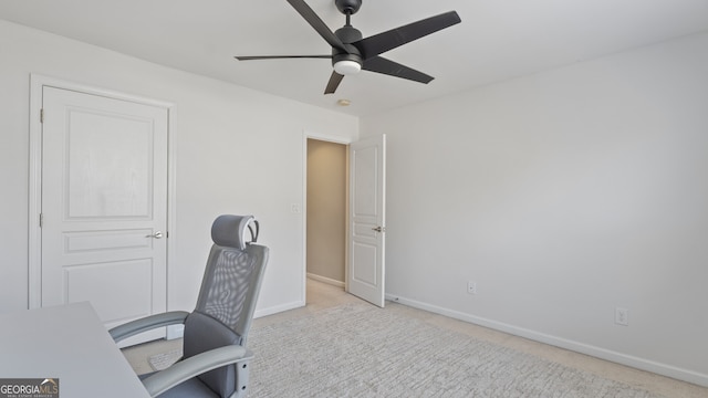 office space featuring light colored carpet and ceiling fan