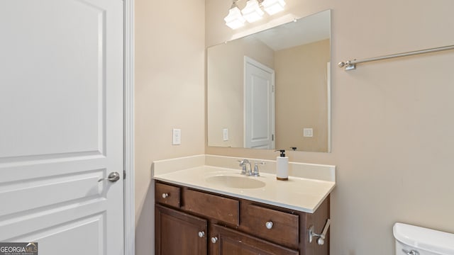 bathroom with vanity and toilet