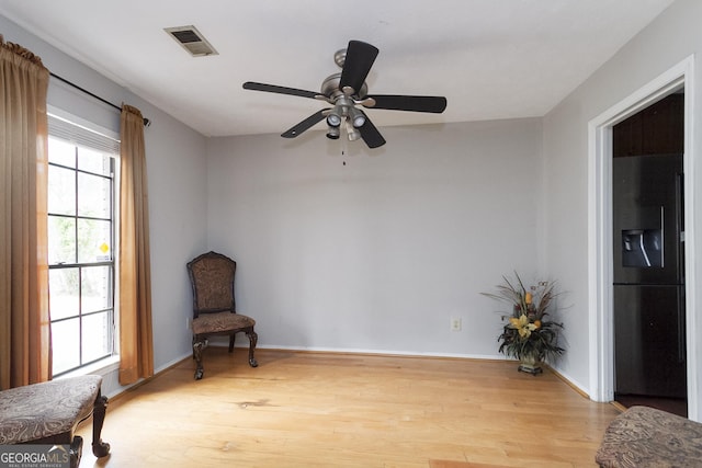 living area with light hardwood / wood-style floors