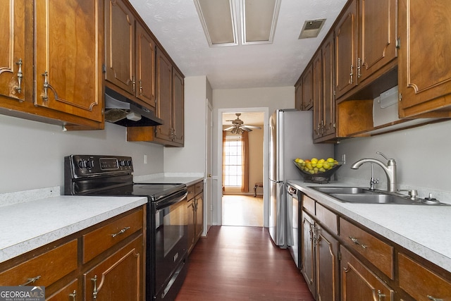 kitchen featuring sink, stainless steel dishwasher, ceiling fan, black range with electric stovetop, and dark wood-type flooring