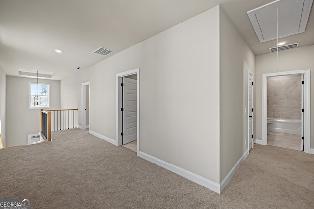 hallway with light carpet