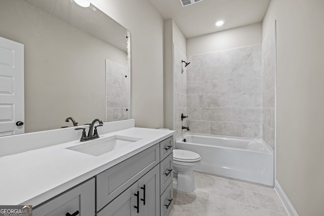 full bathroom featuring vanity, toilet, and tiled shower / bath combo