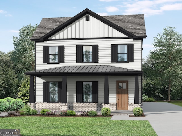 view of front of property with a front yard and covered porch