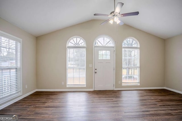 entryway with dark hardwood / wood-style flooring, vaulted ceiling, and ceiling fan