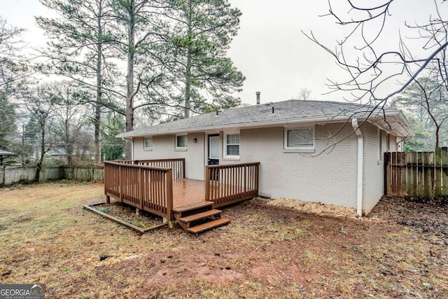 back of house with a wooden deck