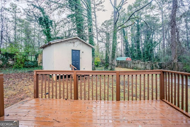 wooden terrace with an outbuilding