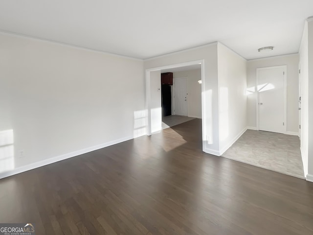 empty room with dark wood-type flooring