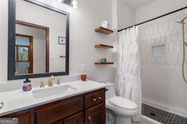 bathroom with vanity, a shower with curtain, and toilet