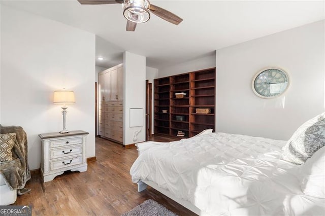 bedroom featuring hardwood / wood-style flooring and ceiling fan