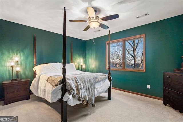 bedroom featuring light colored carpet and ceiling fan