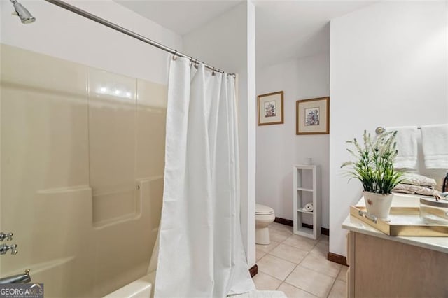 bathroom featuring tile patterned flooring, toilet, and shower / bath combo with shower curtain