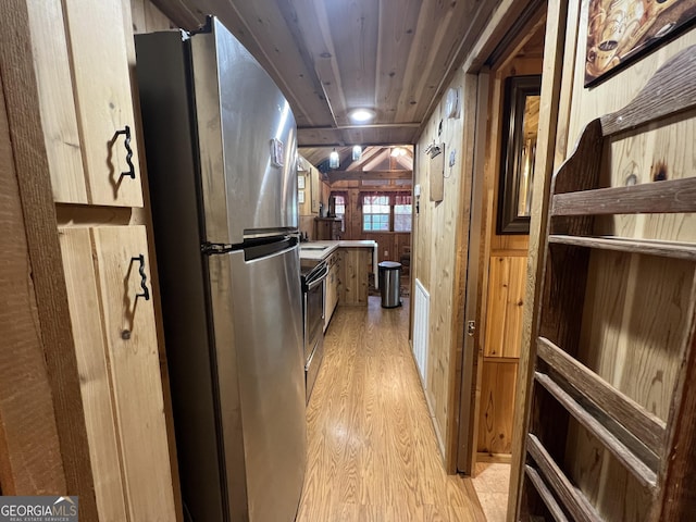 corridor with wood walls, light hardwood / wood-style floors, and wooden ceiling