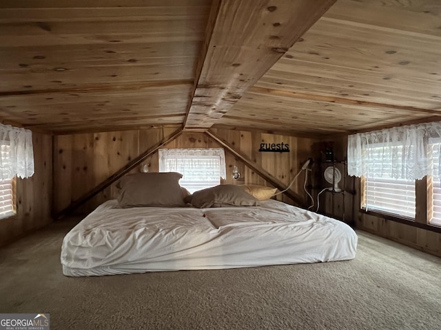 carpeted bedroom with lofted ceiling, wooden ceiling, multiple windows, and wood walls