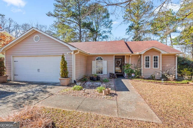 single story home featuring a garage