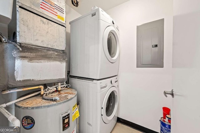 laundry room with electric panel, water heater, and stacked washing maching and dryer