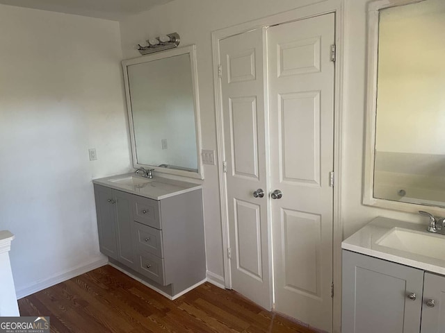 bathroom featuring wood-type flooring and vanity