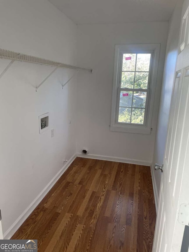 clothes washing area with washer hookup and dark hardwood / wood-style flooring