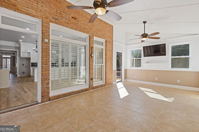 interior space featuring vaulted ceiling and ceiling fan