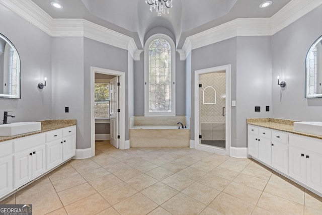 bathroom with crown molding, tile patterned floors, separate shower and tub, and vanity