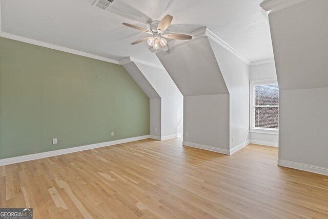 bonus room featuring lofted ceiling, light hardwood / wood-style flooring, and ceiling fan