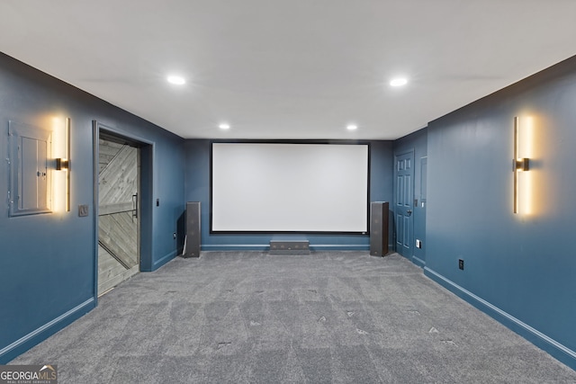 carpeted home theater room featuring electric panel