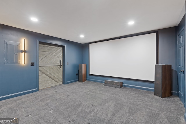 carpeted home theater room with electric panel