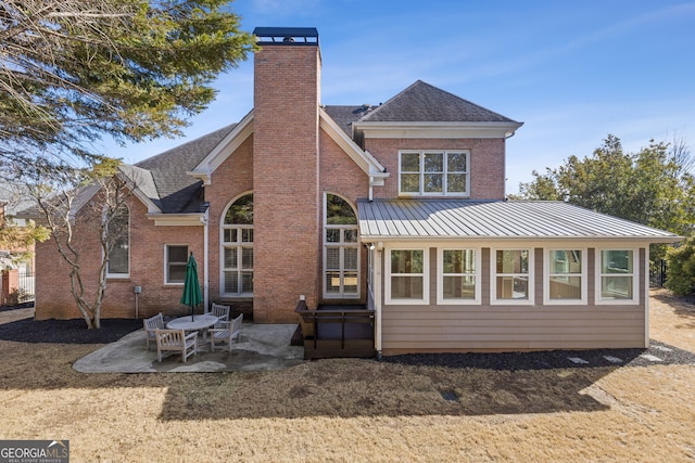 back of property featuring a patio area