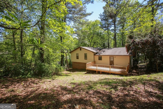 back of property with a deck