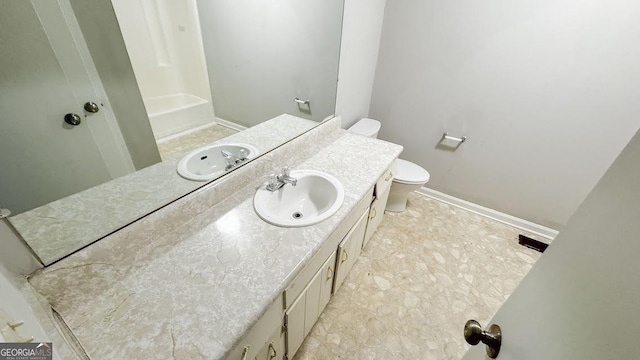bathroom featuring toilet, a tub to relax in, a shower, vanity, and baseboards