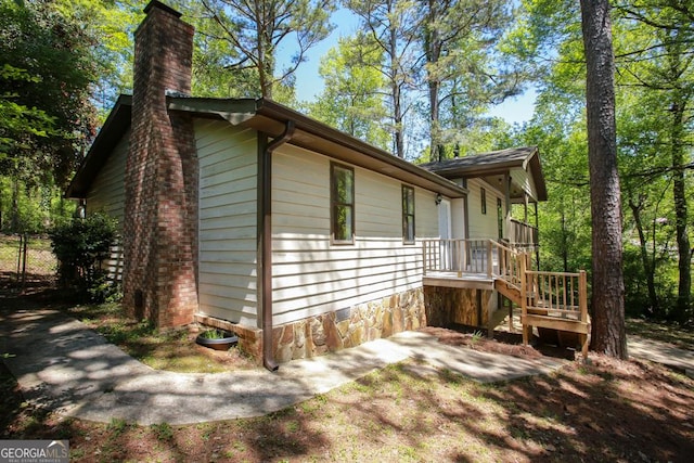view of home's exterior featuring a chimney