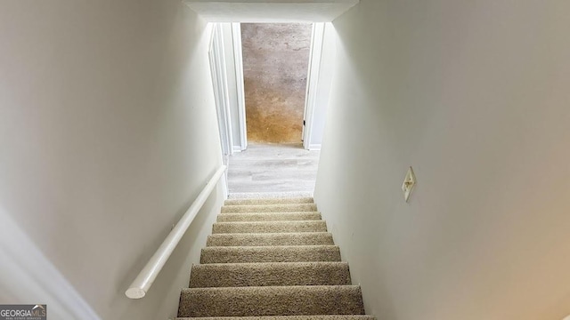 staircase with wood finished floors